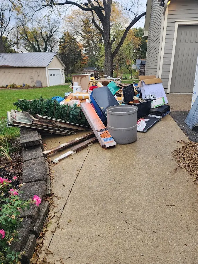 Dumpster being loaded with debris for 3 Yard Dumpster Rental in Bolingbrook